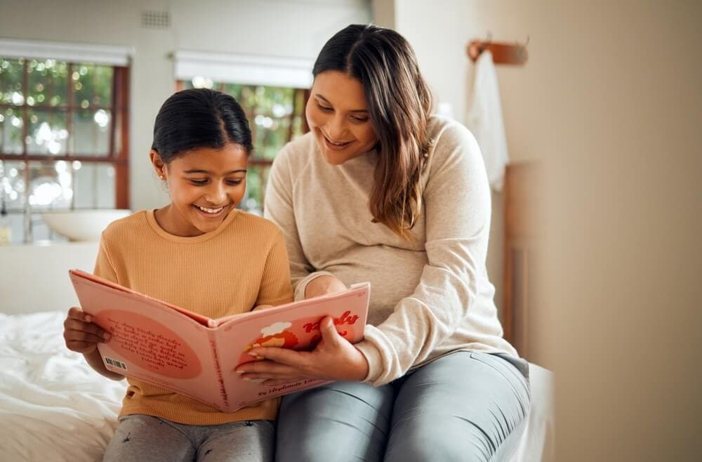 Mother and daughter reading together